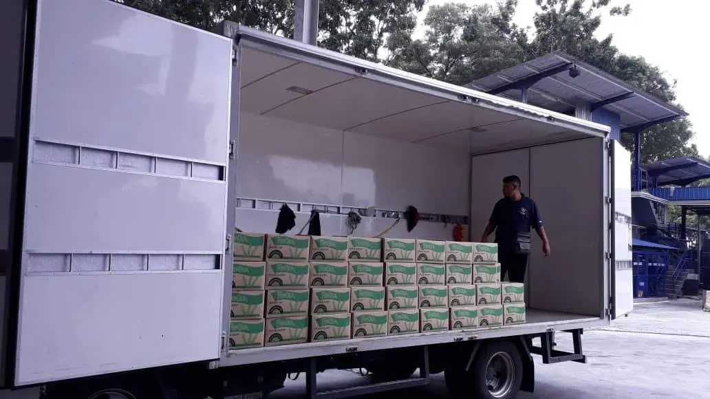 Mileford lorry loaded with multiple boxes of beverages, demonstrating efficient packaged goods handling.